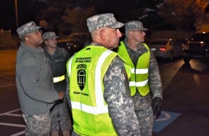 In the predawn darkness GSDF Soldiers assess the early flow of vehicles while performing Traffic Control and Force Protection. Georgia State Defense Force Photo by Pvt. Alexander Davidson