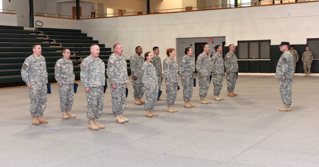 Graduation certificates in hand, Charlie Class members belt out their motto: Honor, Serve, and Persevere. Georgia State Defense Force photo by Spc. Alexander Davidson