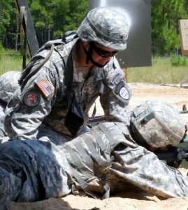 SGT Christopher Lowry coaches Georgia National Guard soldier on the M249 Machine Gun. Photo by SPC Jon Van Holm