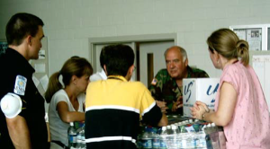 Command Surgeon Col. Harvey coordinates with civilian medical teams.